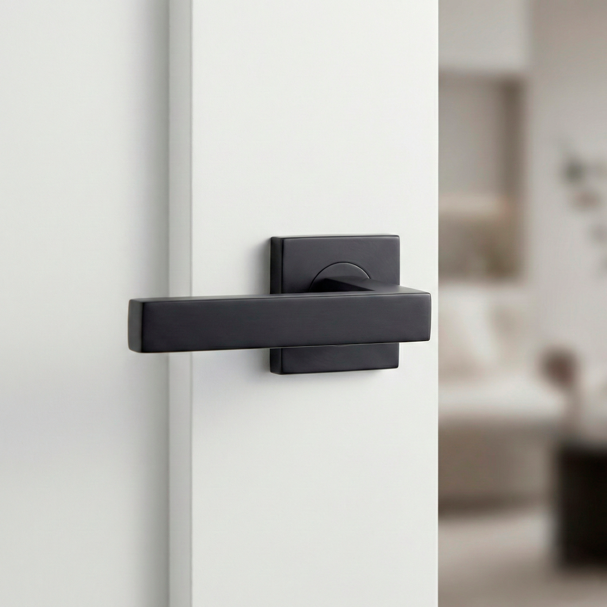 Puxador Dagda em aço inox com acabamento em roseta quadrada preta para portas 